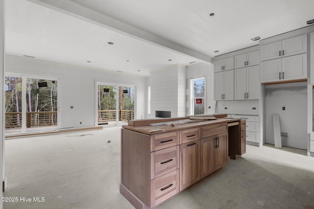 kitchen featuring beam ceiling