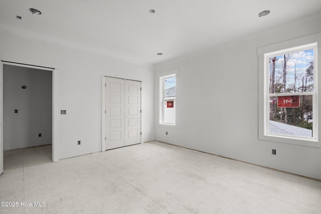 unfurnished bedroom with a closet