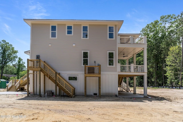 633 Vale Dr, Wilmington, NC 28411 - rear view of property featuring a porch, stairway, and an attached garage