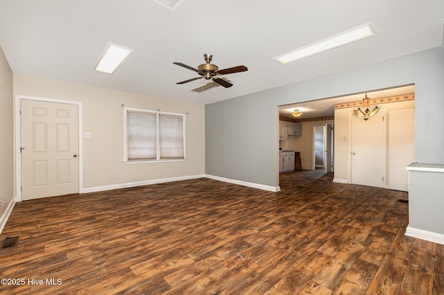 unfurnished living room featuring ceiling fan and dark hardwood / wood-style flooring