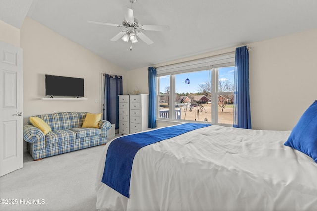 bedroom with lofted ceiling, ceiling fan, and carpet