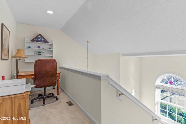 office area featuring baseboards, visible vents, light colored carpet, lofted ceiling, and recessed lighting