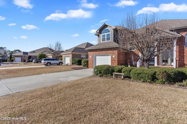 traditional-style home with a garage, brick siding, concrete driveway, a residential view, and a front lawn