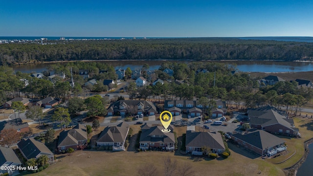 bird's eye view featuring a water view, a residential view, and a view of trees