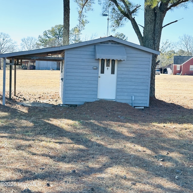 view of outbuilding with a lawn