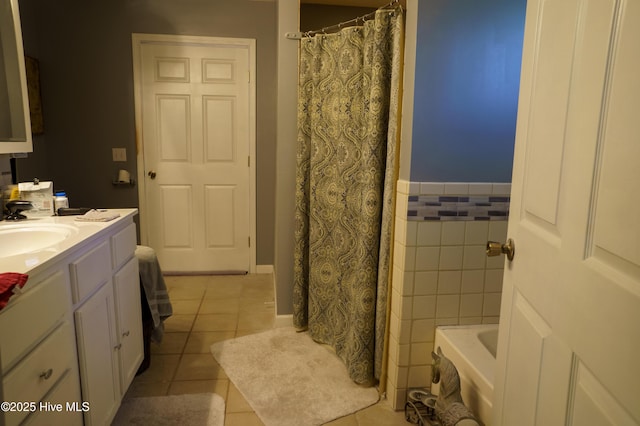 bathroom featuring tile walls, vanity, tile patterned floors, and a shower with curtain