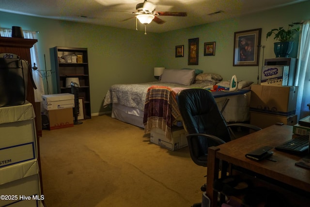 bedroom with ceiling fan and light colored carpet