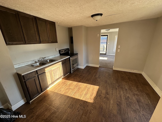 kitchen featuring dark hardwood / wood-style flooring, stainless steel range with electric stovetop, dark brown cabinets, a textured ceiling, and sink