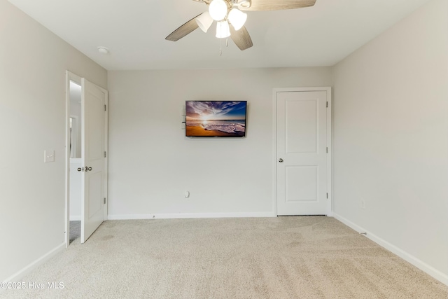 empty room with light carpet and ceiling fan