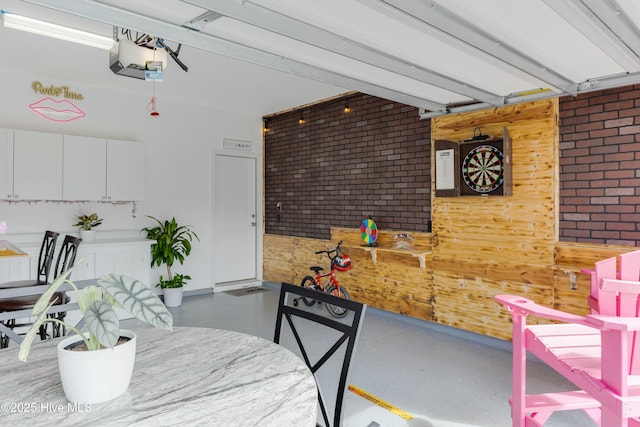 dining room with brick wall