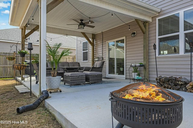 view of patio / terrace featuring an outdoor living space with a fire pit and ceiling fan