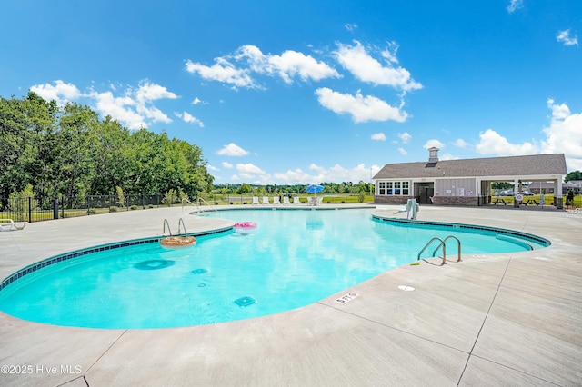 view of swimming pool with a patio