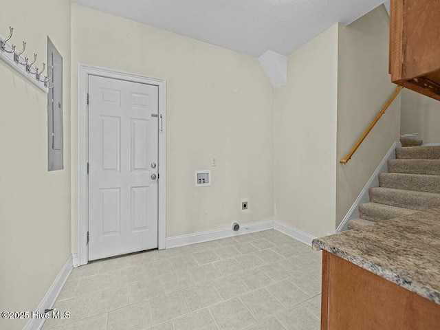 laundry area with cabinets, hookup for a washing machine, electric panel, and hookup for an electric dryer