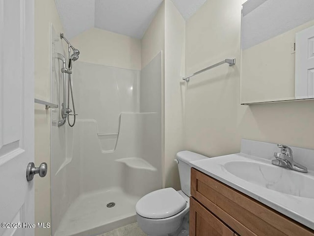 bathroom with vaulted ceiling, a shower, vanity, toilet, and a textured ceiling