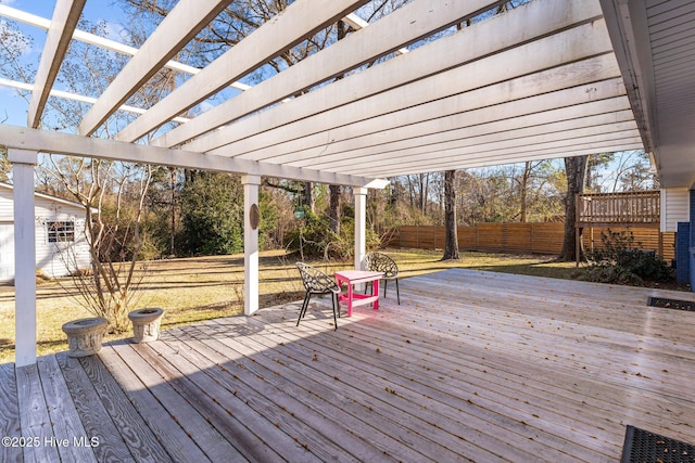 deck with a shed and a pergola