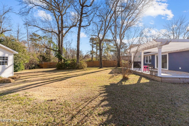 view of yard featuring a wooden deck and a pergola