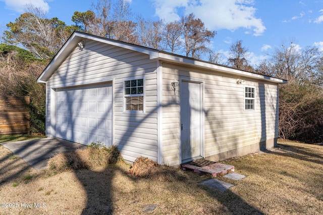 garage featuring a yard