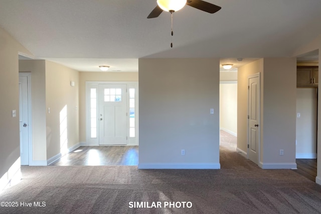 carpeted entrance foyer with ceiling fan and lofted ceiling