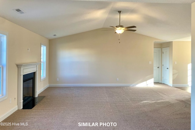 unfurnished living room with light carpet, vaulted ceiling, and ceiling fan