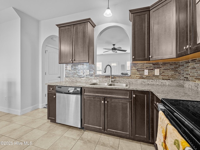 kitchen featuring sink, dark brown cabinetry, appliances with stainless steel finishes, and light tile patterned flooring