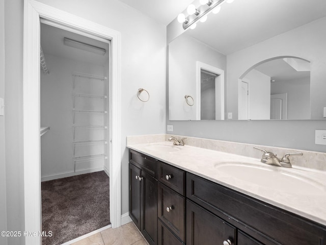 bathroom with vanity and tile patterned flooring