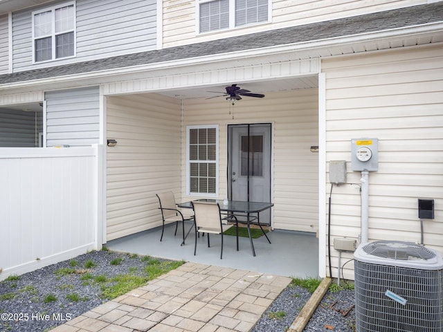 view of patio with ceiling fan and central air condition unit