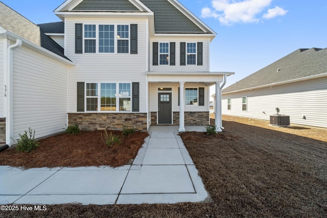 craftsman-style house featuring central AC and covered porch