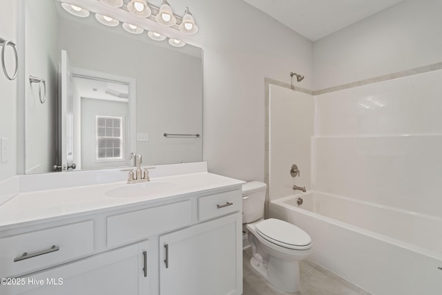 full bathroom with tile patterned flooring, shower / washtub combination, vanity, and toilet