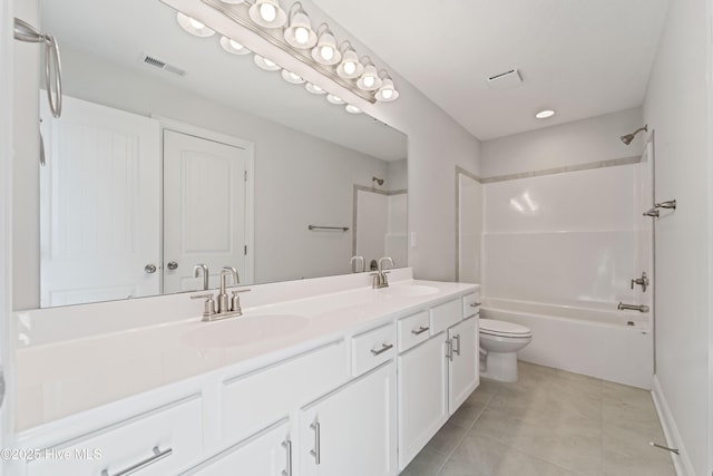 full bathroom with washtub / shower combination, tile patterned floors, toilet, and vanity