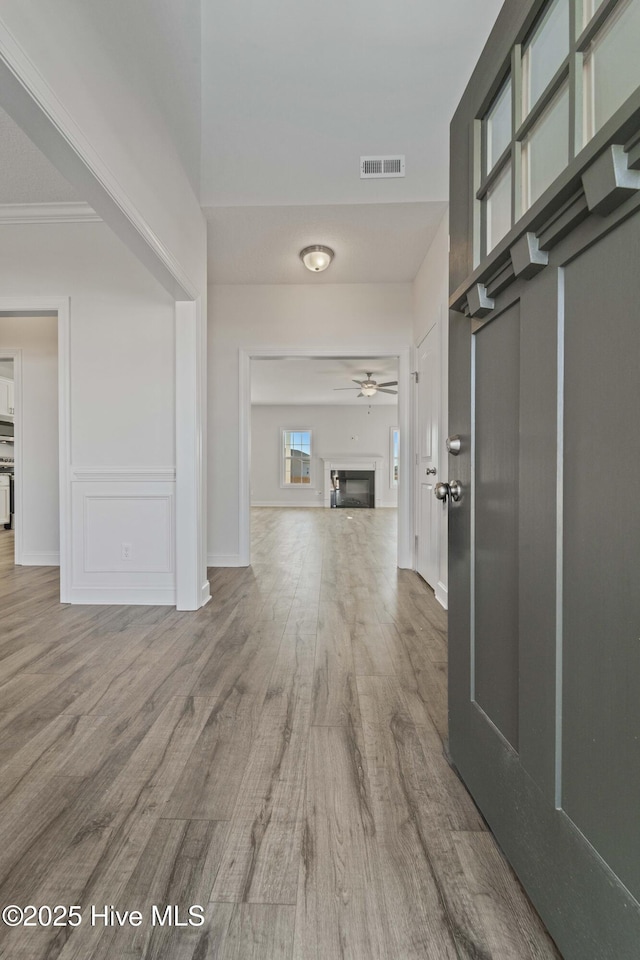 hallway with wood-type flooring