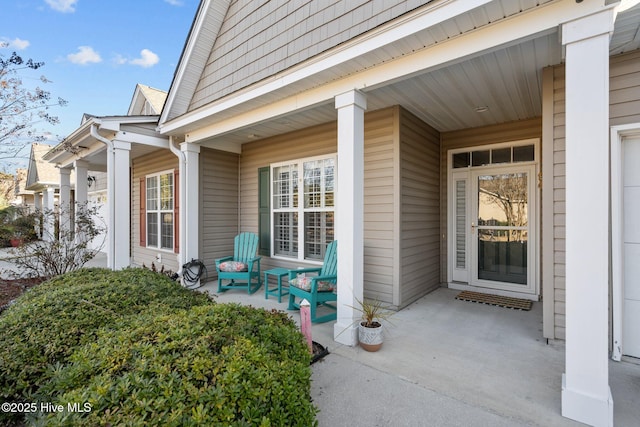 view of exterior entry with covered porch