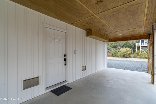 view of exterior entry featuring a patio