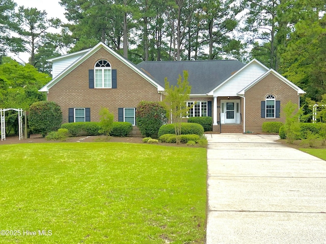 6104 Falcon Dr, New Bern, NC 28560 - view of front of home with brick siding and a front yard
