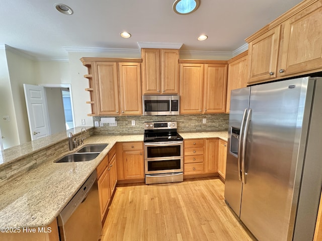 6104 Falcon Dr, New Bern, NC 28560 - kitchen with stainless steel appliances, crown molding, light wood-style floors, light stone counters, and a peninsula