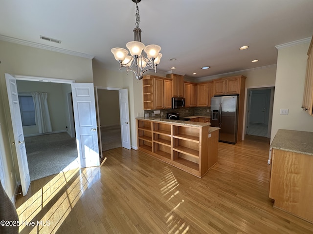 kitchen featuring open shelves, visible vents, light wood-style flooring, appliances with stainless steel finishes, and a peninsula