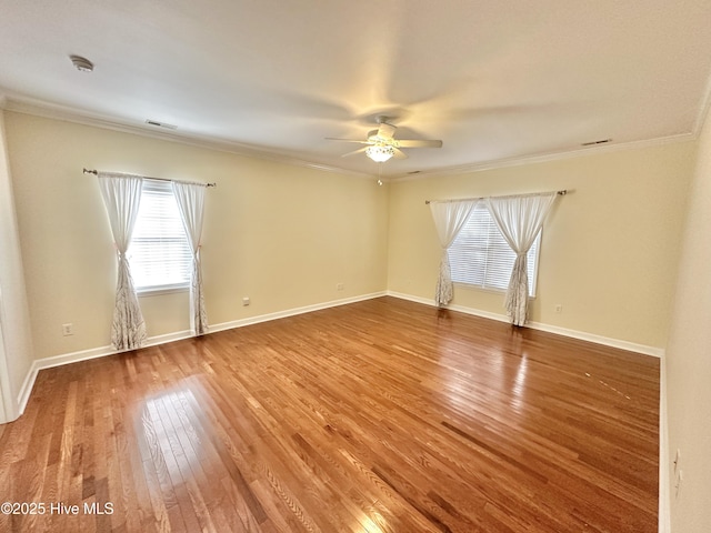 6104 Falcon Dr, New Bern, NC 28560 - empty room featuring a ceiling fan, a smoke detector, wood finished floors, and ornamental molding