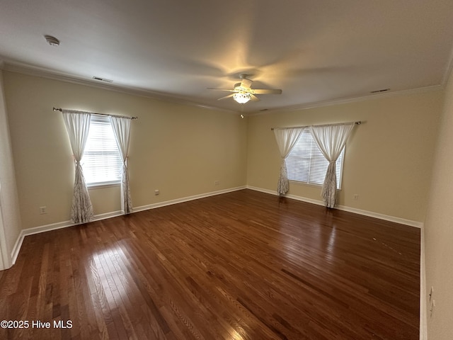 unfurnished room featuring ornamental molding, dark wood finished floors, baseboards, and ceiling fan