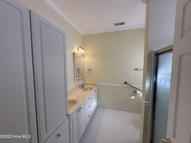 full bath featuring double vanity, visible vents, tile patterned floors, crown molding, and a sink