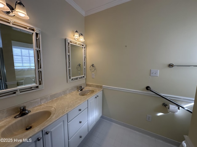 bathroom featuring double vanity, tile patterned flooring, crown molding, and a sink