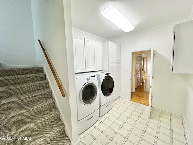 6104 Falcon Dr, New Bern, NC 28560 - washroom featuring washer and clothes dryer, light flooring, cabinet space, and crown molding