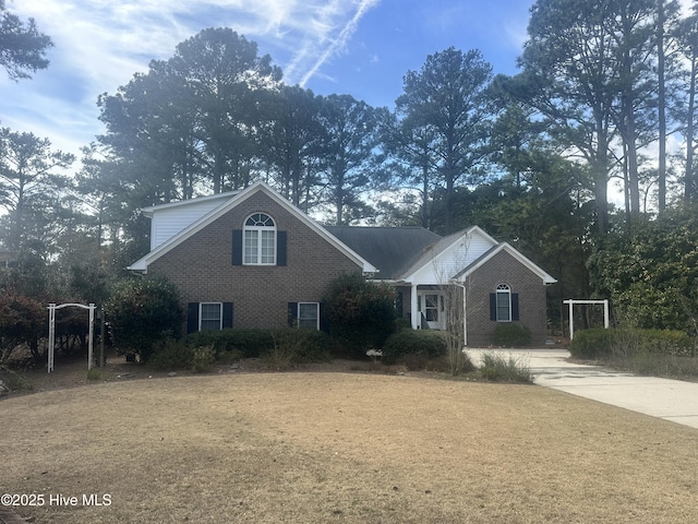 view of front of home featuring brick siding