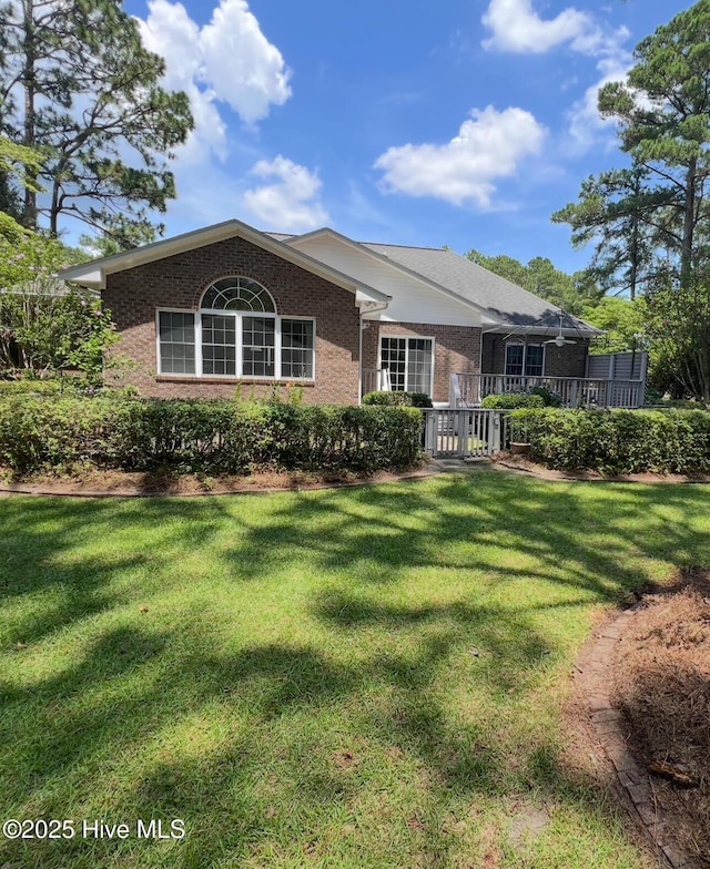 6104 Falcon Dr, New Bern, NC 28560 - view of front facade featuring brick siding and a front yard