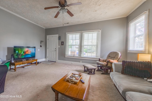 living room with carpet flooring, a textured ceiling, ceiling fan, and crown molding