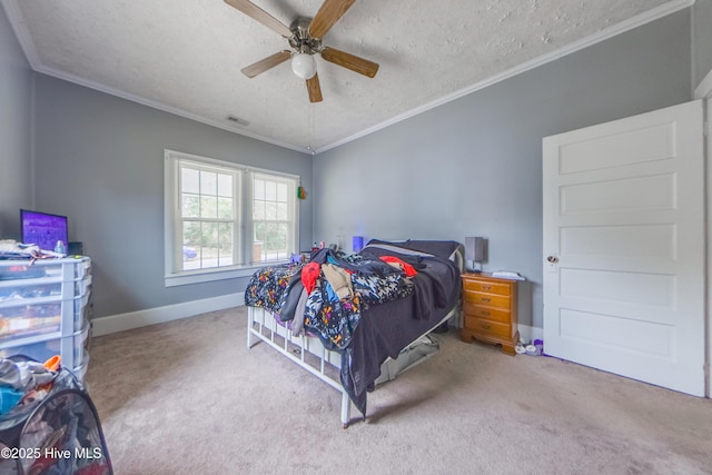 carpeted bedroom with ceiling fan, crown molding, and a textured ceiling