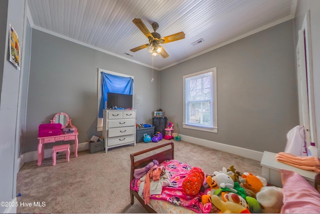 carpeted bedroom featuring ceiling fan and crown molding