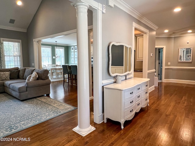 hallway with vaulted ceiling, dark hardwood / wood-style floors, and ornate columns