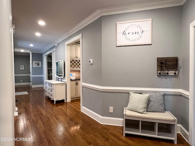 corridor with dark hardwood / wood-style floors and crown molding