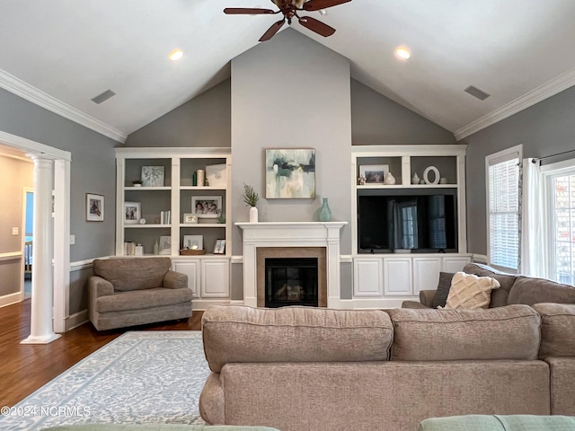 living room featuring ceiling fan, crown molding, dark wood-type flooring, and vaulted ceiling