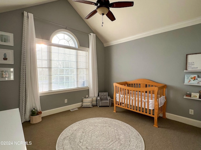 carpeted bedroom with multiple windows, ceiling fan, and lofted ceiling