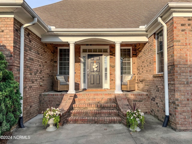 doorway to property with a porch